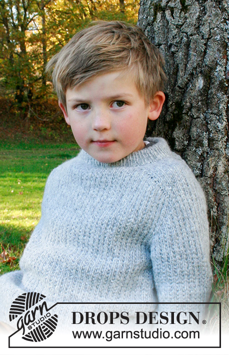 Weekend Games Jumper / DROPS Children 40-20 - Knitted jumper for children in DROPS Sky. The piece is worked top down with double neck, textured pattern and saddle shoulders. Sizes 3 – 14 years.