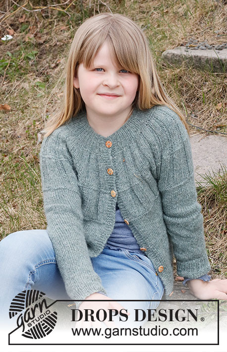 Mayan Woods Cardigan / DROPS Children 40-22 - Knitted jacket for children in DROPS Sky. The piece is worked top down with round yoke and rib on the yoke. Sizes 3 to 14 years.