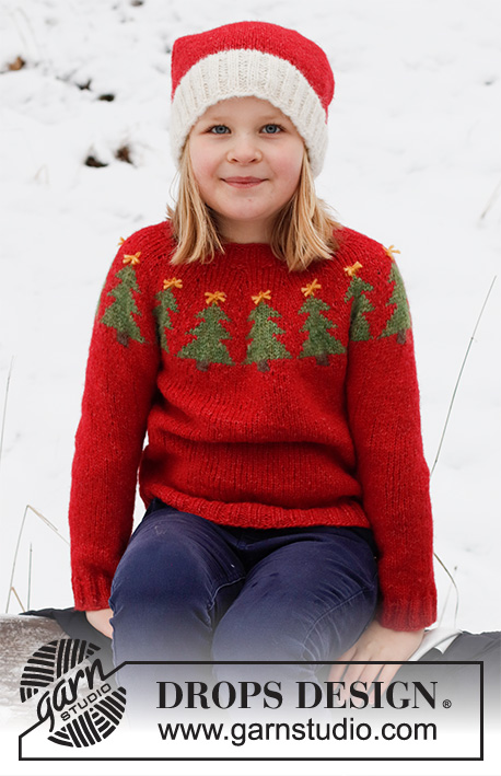 Merry Trees / DROPS Children 41-17 - Pull de Noël et bonnet enfant tricotés en DROPS Air. Le pull se tricote de haut en bas avec empiècement arrondi et jacquard sapin de Noël. Le bonnet tricote en rond, de bas en haut. Du 2 au 14 ans. Thème: Noël.