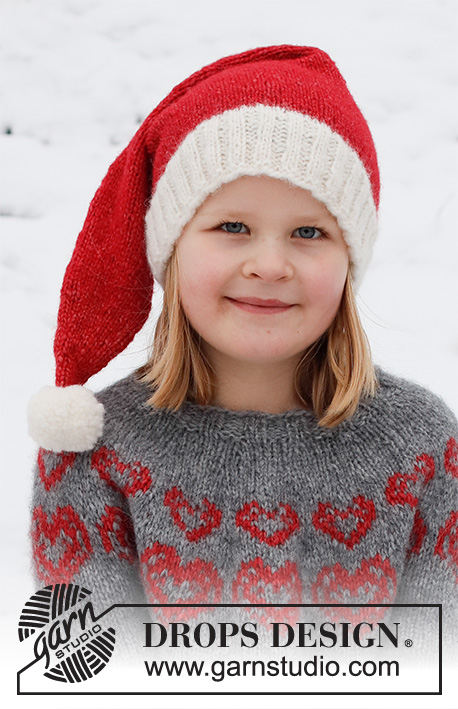 Merry Hearts Hat / DROPS Children 41-19 - Gestrickte Mütze für Kinder in DROPS Air. Die Mütze wird glatt rechts mit Rippenmuster gestrickt. Größe 2 - 14 Jahre. Thema: Weihnachten.