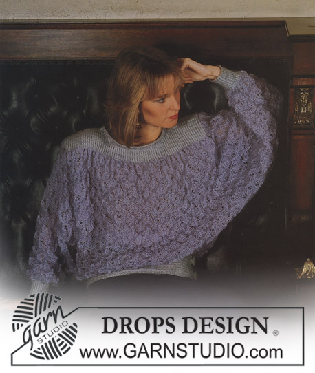 DROPS Extra 0-131 - DROPS jumper with lace pattern in “Toscana” and borders in “Silke”. Size S-M.