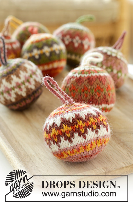 Jolly Holly Days / DROPS Extra 0-1607 - Knitted baubles in DROPS Lima. The piece is worked in the round, bottom up, with multi-colored Nordic pattern. Theme: Christmas.