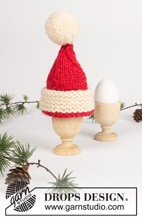 Santa's Breakfast / DROPS Extra 0-569 - Knitted egg warmer and napkin ring in DROPS Alaska. Egg warmer is worked as a santa hat with pompoms. Theme: Christmas