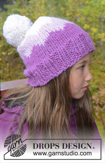 Pink Mountain / DROPS Extra 0-977 - Knitted DROPS hat with pompom and zig-zag pattern in ”Andes”. Size 3-12 years.