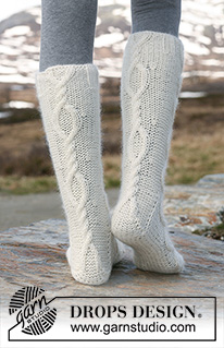 Aran Dance / DROPS 114-6 - Knitted DROPS Socks with cables in ”Merino Extra Fine” and ”Kid-Silk”. 