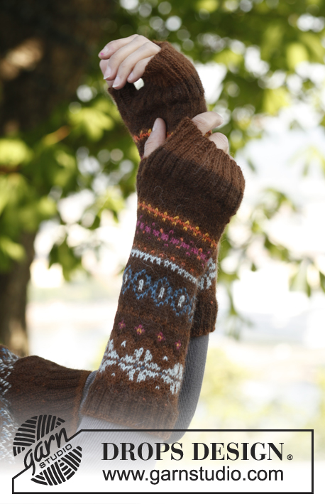 Autumn Aurora / DROPS 143-28 - Set consist of: Knitted DROPS poncho, hat and wrist warmers with fair-isle pattern in ”Alpaca”. Size: S - XXXL.