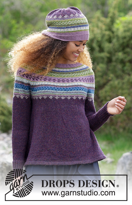 Blueberry Fizz / DROPS 180-7 - The set consists of knitted jumper with round yoke, multi-colored Norwegian pattern and A-shape, worked top down. Sizes S - XXXL. Hat with multi-colored Norwegian pattern.
The set is worked in DROPS Alpaca.
