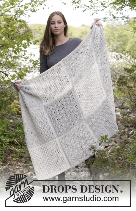 Twelve Clouds / DROPS 181-32 - Knitted blanket with squares in lace pattern.
Piece is knitted in 2 strands DROPS Alpaca.