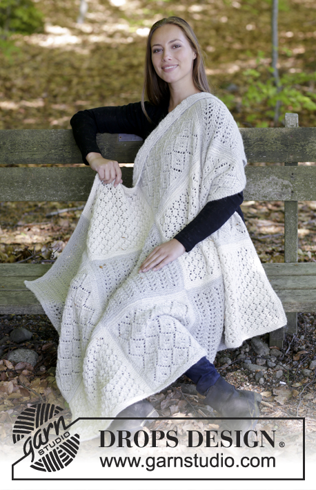 Twelve Clouds / DROPS 181-32 - Knitted blanket with squares in lace pattern.
Piece is knitted in 2 strands DROPS Alpaca.