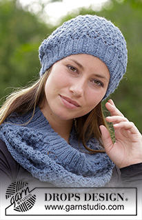 Poetry / DROPS 182-3 - The set consists of: Knitted hat and neck warmer with lace pattern.
The set is worked in DROPS Puna.