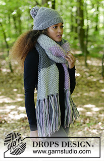 So Chill / DROPS 182-34 - The set consists of: Knitted scarf in seed stitch with fringe and hat with stripes in stockinette stitch and seed stitch.
The piece is worked in DROPS Snow.