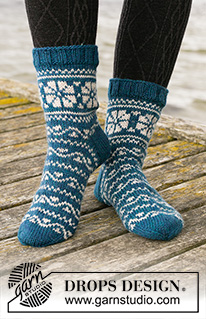 Fabled Cottage / DROPS 203-25 - Knitted socks in DROPS Karisma. The piece is worked top down with Nordic pattern. Sizes 35 – 43 = 5 – 10 1/2”.