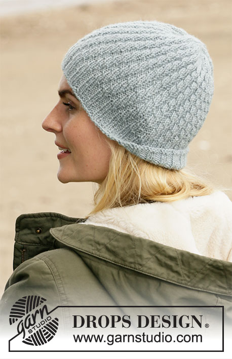 Cannery Row / DROPS 204-35 - Knitted hat in DROPS Karisma. Piece is knitted with rib and spiral pattern.