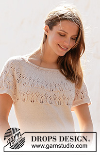 New Beginnings / DROPS 212-38 - Knitted, fitted top in DROPS Cotton Merino. Piece is knitted with vents in the sides, short sleeves and round yoke with lace pattern. Size: S - XXXL