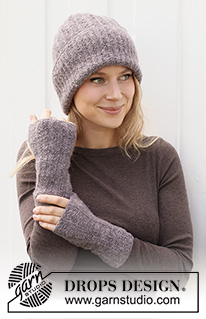 Chill of Dawn / DROPS 214-15 - Knitted beanie / hipster hat and wrist warmers in DROPS Sky with garter stitch and English rib stitch.