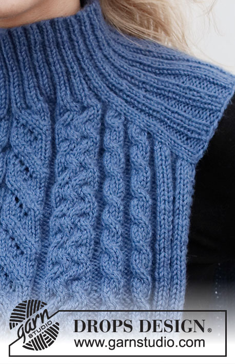 Cool Cables Set / DROPS 214-25 - Knitted hat, neck warmer with saddle shoulder and mittens in DROPS Merino Extra Fine. The whole set is worked with cables and ribbed edging.