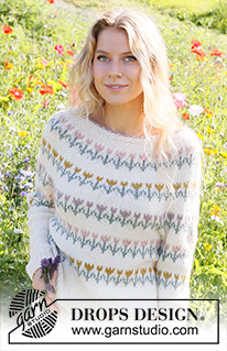 Spring Parade / DROPS 230-8 - Knitted jumper in DROPS Sky. The piece is worked top down with round yoke, flowers/folklore pattern. Sizes S - XXXL.