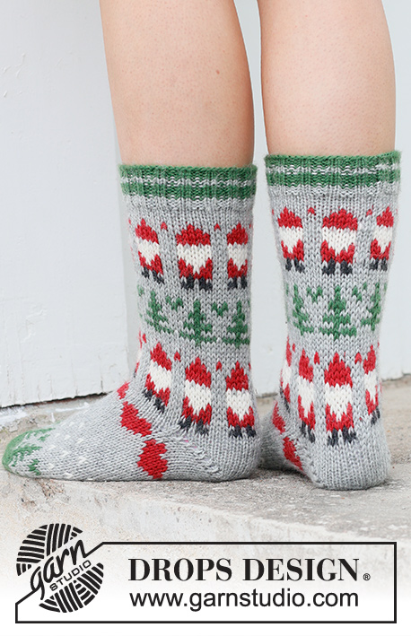 Christmas Time Socks / DROPS 234-63 - Chaussettes tricotées en DROPS Karisma. Se tricotent de haut en bas en jacquard Père Noël, sapin de Noël et cœur. Du 35 au 43. Thème: Noël.