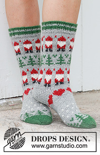 Christmas Time Socks / DROPS 234-63 - Knitted socks in DROPS Karisma. The piece is worked top down with coloured Santa, Christmas tree and heart-pattern. Sizes 35 – 43. Theme: Christmas.