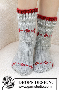 Christmas Sparkle Socks / DROPS 234-75 - Knitted socks in DROPS Snow. Piece is knitted top down with stocking stitch and Nordic pattern. Size 35 to 43 Theme: Christmas.
