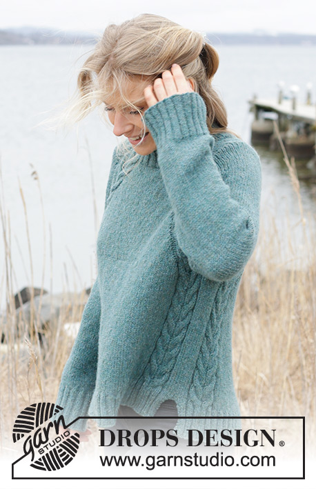 Emerald Lake Sweater / DROPS 244-12 - Knitted sweater in DROPS Sky. The piece is worked top down with high neck, raglan, cables and split in sides. Sizes XS - XXL.