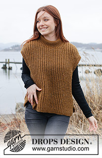 Caramel Ridge / DROPS 244-19 - Knitted vest in DROPS Alaska. The piece is worked bottom up, with English rib and split in sides. Sizes S - XXXL.