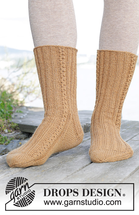 Dancing in Sunshine / DROPS 244-38 - Knitted socks with rib and cables in DROPS Nord. Sizes 35 – 43.