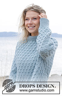 Mermaid Bay / DROPS 245-1 - Knitted jumper in DROPS Nepal. The piece is worked top down with double neck, raglan, bee-cube pattern and split in sides. Sizes S - XXXL.