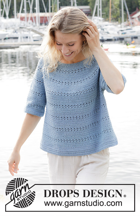 Bonnie Blue / DROPS 250-9 - Crocheted jumper in DROPS Belle. The piece is worked in the round, top down with round yoke, lace pattern, short sleeves and split in sides. Sizes S - XXXL.