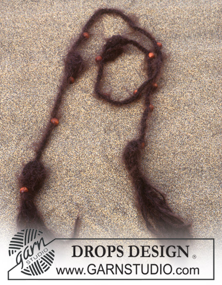 DROPS 95-12 - Lång DROPS kofta med hålmönster i ”Paris” och hårband i ”Symphony”. Stl XS/S-XXL 