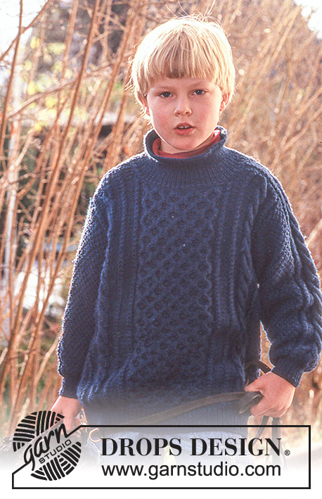 Boy Blue / DROPS Baby 10-14 - Strikket genser til barn i DROPS Karisma. Arbeidet strikkes med strukturmønster og flettemønster. Størrelse 3 - 8 år.
