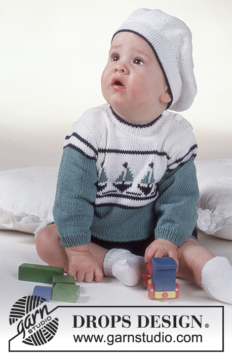 Le Petit Explorateur / DROPS Baby 2-5 - Strikket sett med genser, shorts og baskerlue til baby i DROPS Safran. Arbeidet strikkes med striper og flerfarget mønster med båt. Størrelse 3 mnd - 2 år.