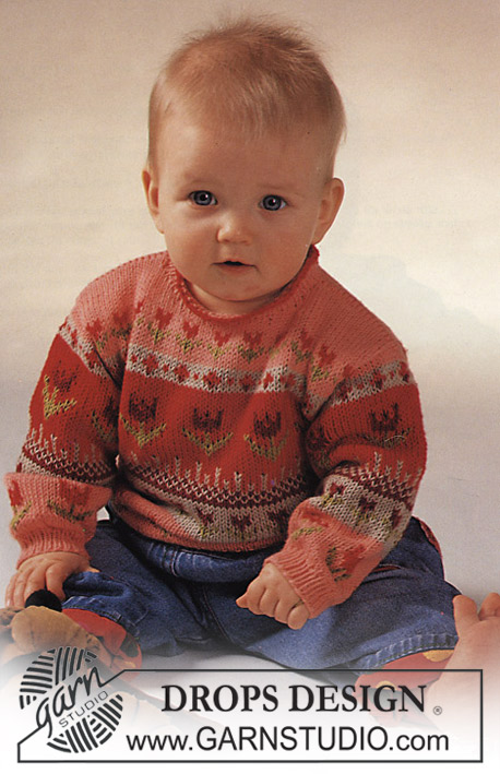 DROPS Baby 2-7 - Strikket genser til baby i DROPS Safran. Arbeidet strikkes med flerfarget mønster med blomster. Størrelse 3 mnd - 2 år.