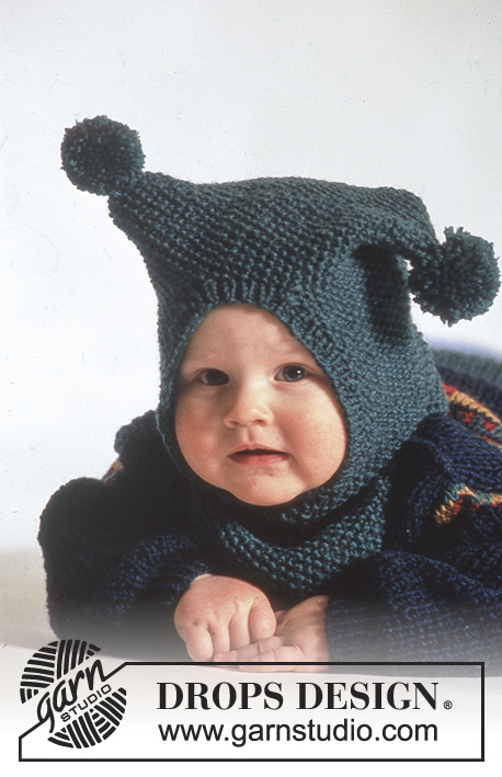 Polichinelle / DROPS Baby 3-14 - DROPS jumper with star pattern, trousers, booties and hat / balaclava with pompoms in “Karisma”.