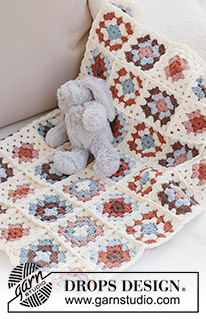 Cuddle Time / DROPS Baby 42-14 - Manta de bebé crochetada com das quadrados Granny, em DROPS Merino Extra Fine.