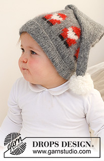 Merry Santas Hat / DROPS Baby 42-22 - Knitted hat for baby in DROPS Air. The piece is worked with Santas and a pom pom. Sizes 0 - 2 years. Theme: Christmas.