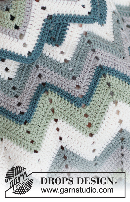 Green Spring Blanket / DROPS Baby 46-15 - Crocheted baby blanket in DROPS Merino Extra Fine. Piece is worked with zig-zag pattern.