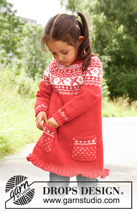 Selina / DROPS Children 22-20 - Knitted DROPS tunic worked top down in ”Karisma” with round yoke and Norwegian pattern. 
Size 3 - 12 years.
