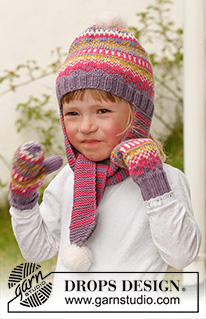 Fideli / DROPS Children 23-42 - Set of knitted hat with long ear flaps (scarf) and pompoms plus mittens in DROPS Merino Extra Fine. Size children 3 to 12 years.