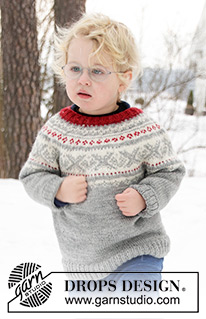 Narvik / DROPS Children 32-12 - Pull enfant tricoté de haut en bas en DROPS Karisma, avec empiècement arrondi et jacquard nordique. Du 2 au 12 ans.