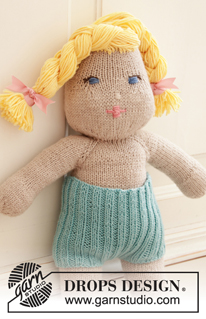 Cora / DROPS Children 35-12 - Knitted doll with short pants and tube socks. The doll is worked top down in stocking stitch with 2 strands DROPS BabyMerino or 1 strand  DROPS Big Merino, and DROPS Cotton Merino. Short pants and tube socks are worked in rib with 1 strand DROPS BabyMerino.