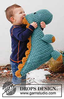 Dino Cuddles / DROPS Children 41-29 - Crocheted Dinosaur (T-Rex) in 2 strands DROPS Snow. The piece is worked from nose to tail with 1 seam. Theme: Soft toys.