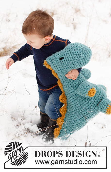 Dino Cuddles / DROPS Children 41-29 - Crocheted Dinosaur (T-Rex) in 2 strands DROPS Snow. The piece is worked from nose to tail with 1 seam. Theme: Soft toys.