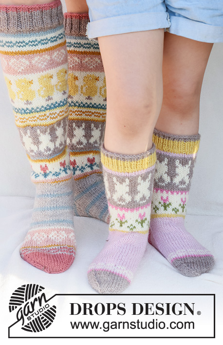 Dancing Bunny Socks / DROPS Children 41-35 - Knitted socks for children in DROPS Karisma. The piece is worked top down in stockinette stitch, with multi-colored pattern and heart, Easter chick, Easter bunny and flower. Sizes 24 – 43 = US 8-12 1/2. Theme: Easter.