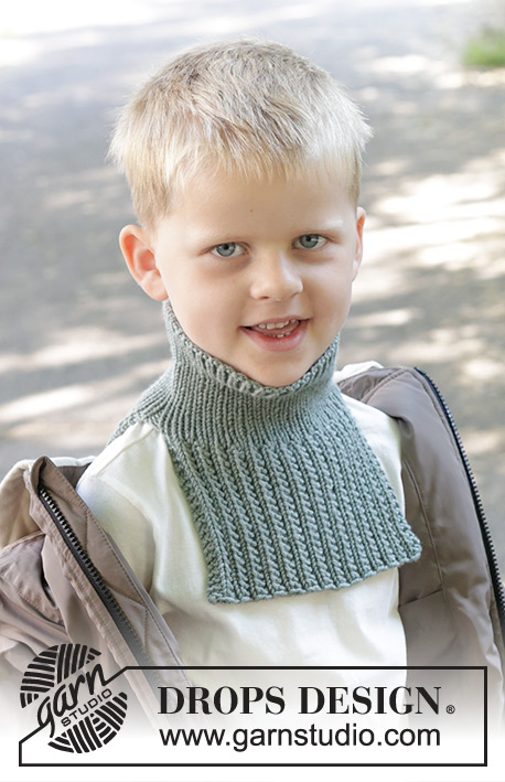 Trailhead Neck Warmer / DROPS Children 47-23 - Gola com peitilho tricotada para criança em DROPS Merino Extra Fine. Tricota-se de cima para baixo com ponto fantasia em relevo. Tamanhos: 2 - 12 anos.