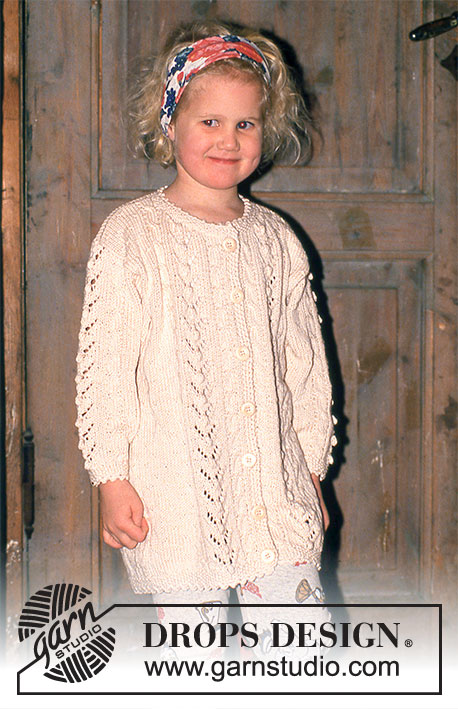 Lacy Bobbles / DROPS Children 6-10 - Cardigan in Muskat with Cables and Bobbles.